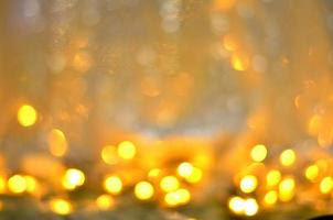 Golden glitter bokeh lighting texture Blurred abstract background for birthday, anniversary, wedding, new year eve or Christmas photo