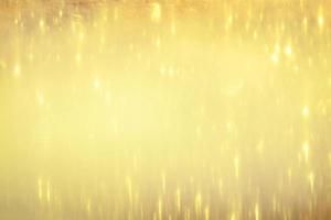 Golden glitter bokeh lighting texture Blurred abstract background for birthday, anniversary, wedding, new year eve or Christmas photo