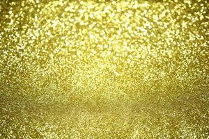 Golden glitter bokeh lighting texture Blurred abstract background for birthday, anniversary, wedding, new year eve or Christmas photo