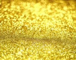 Golden glitter bokeh lighting texture Blurred abstract background for birthday, anniversary, wedding, new year eve or Christmas photo