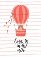 A Valentine's day card with a cute bear flying in a balloon and a handwritten phrase - Love is in the air. A symbol of love, romance. Color flat vector illustration of striped texture background.