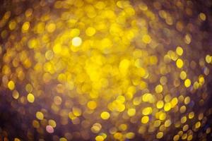 Golden glitter bokeh lighting texture Blurred abstract background for birthday, anniversary, wedding, new year eve or Christmas photo