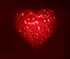 Red Blur heart shape of ligth bokeh on a black background photo