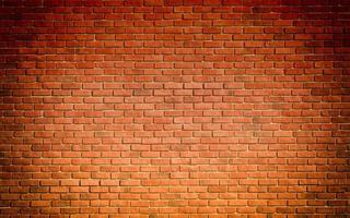 Red brown block brick wall Beautifully arranged texture background. photo