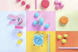 colorful macarons or macaroons dessert sweet beautiful and watch or pen with vintage pastel background photo