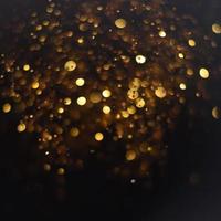 Golden glitter bokeh lighting texture Blurred abstract background for birthday, anniversary, wedding, new year eve or Christmas photo