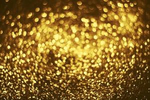 Golden glitter bokeh lighting texture Blurred abstract background for birthday, anniversary, wedding, new year eve or Christmas photo