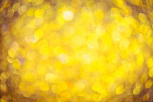 Golden glitter bokeh lighting texture Blurred abstract background for birthday, anniversary, wedding, new year eve or Christmas photo