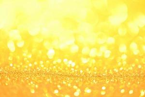 Golden glitter bokeh lighting texture Blurred abstract background for birthday, anniversary, wedding, new year eve or Christmas photo