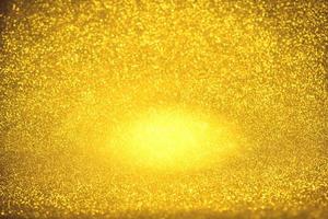 Golden glitter bokeh lighting texture Blurred abstract background for birthday, anniversary, wedding, new year eve or Christmas photo