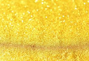 Golden glitter bokeh lighting texture Blurred abstract background for birthday, anniversary, wedding, new year eve or Christmas photo