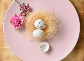 quail eggs in the nest on dish photo