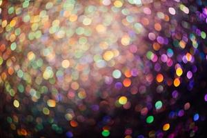 bokeh effect glitter colorful blurred abstract background for birthday, anniversary, wedding, new year eve or Christmas photo