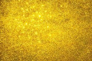 Golden glitter bokeh lighting texture Blurred abstract background for birthday, anniversary, wedding, new year eve or Christmas photo