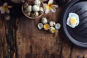 quail eggs on a vintage wooden background photo