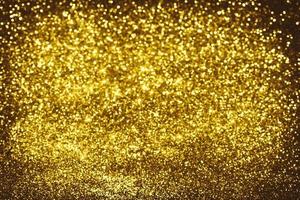 Golden glitter bokeh lighting texture Blurred abstract background for birthday, anniversary, wedding, new year eve or Christmas photo