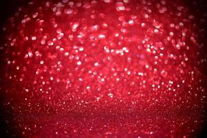 red glitter bokeh lights Blurred abstract background for Valentines, birthday, anniversary, wedding, new year and Christmas photo