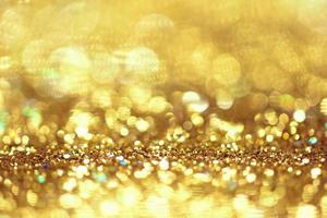 Golden glitter bokeh lighting texture Blurred abstract background for birthday, anniversary, wedding, new year eve or Christmas photo