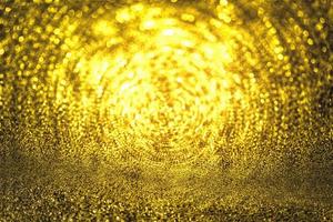 Golden glitter bokeh lighting texture Blurred abstract background for birthday, anniversary, wedding, new year eve or Christmas photo