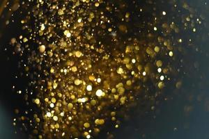 Golden glitter bokeh lighting texture Blurred abstract background for birthday, anniversary, wedding, new year eve or Christmas photo