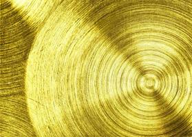 un hierro de metal dorado con fondo de textura circular foto