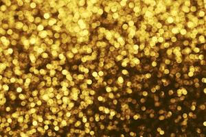 Golden glitter bokeh lighting texture Blurred abstract background for birthday, anniversary, wedding, new year eve or Christmas photo