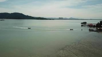 Aerial boats arrive Pulau Aman island. video