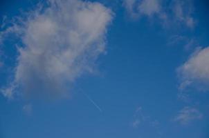 airplane at the sky with clouds photo