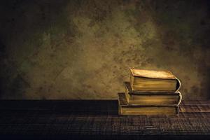 old books vintage on wood floor and paper aged background or texture photo