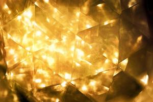 Golden glitter bokeh lighting texture Blurred abstract background for birthday, anniversary, wedding, new year eve or Christmas photo