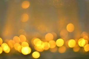 Golden glitter bokeh lighting texture Blurred abstract background for birthday, anniversary, wedding, new year eve or Christmas photo