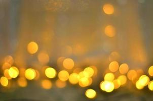 Golden glitter bokeh lighting texture Blurred abstract background for birthday, anniversary, wedding, new year eve or Christmas photo