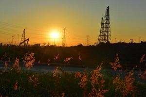 construction site and electrical Pole with Sunrise sky photo