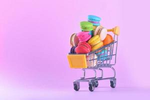 Colorful macarons or macaroons in shopping cart dessert sweet beautiful to eat photo