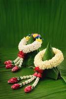 Thai traditional jasmine garland.symbol of Mother's day in thailand on Banana leaf photo