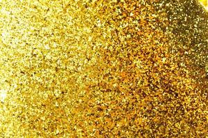 Golden glitter bokeh lighting texture Blurred abstract background for birthday, anniversary, wedding, new year eve or Christmas photo