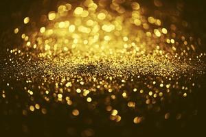 Golden glitter bokeh lighting texture Blurred abstract background for birthday, anniversary, wedding, new year eve or Christmas photo