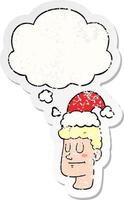 cartoon man wearing christmas hat and thought bubble as a distressed worn sticker vector