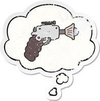cartoon ray gun and thought bubble as a distressed worn sticker vector