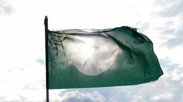 PAS flag moved with cloud and sun behind. video