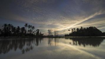 Timelapse sunset of architecture High-voltage tower and coconut trees video