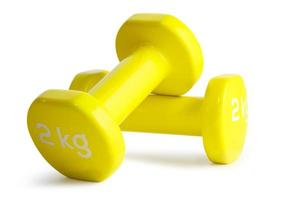 Two yellow  dumbbells isolated on white background with clipping path photo