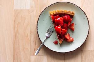 a piece of fresh strawberry cake on a decorative plate photo