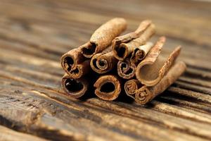 Cinnamon Stick on Wooden Background photo