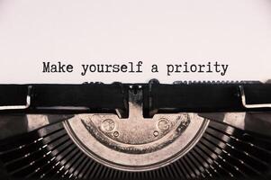 Make yourself a priority text on an old vintage typewriter. photo