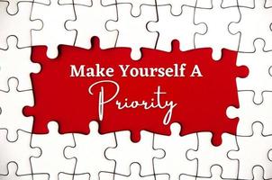 Text on missing jigsaw puzzle - Make yourself a priority. photo