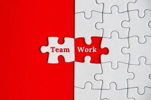 Text on missing jigsaw puzzle - Team Work. Team concept photo