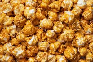 Background texture of popcorn in caramel glaze. Close up.