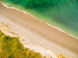 Dramatic aerial view to the coast of Normandy in Etretat, France photo