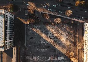 Aerial view of empty field surrounded by buildings. Blank space property banner background photo